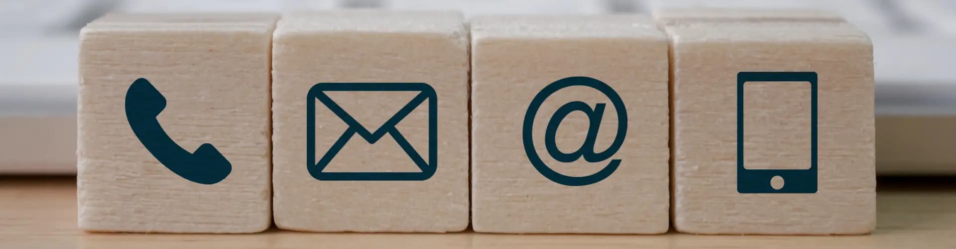 contact method icons on wooden blocks