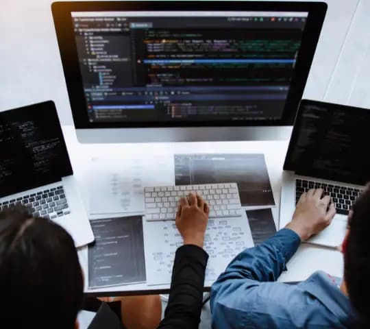 two people working on computers